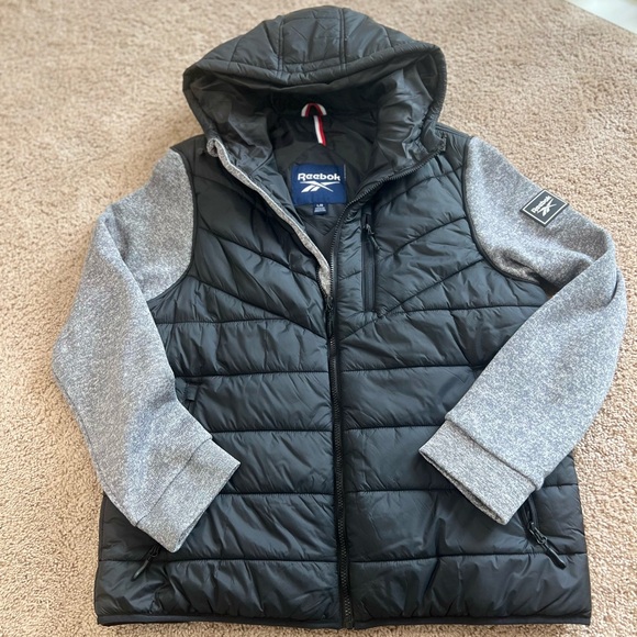 Reebok men's black hooded puffer jacket with grey heather sweater sleeves - Picture 1 of 4